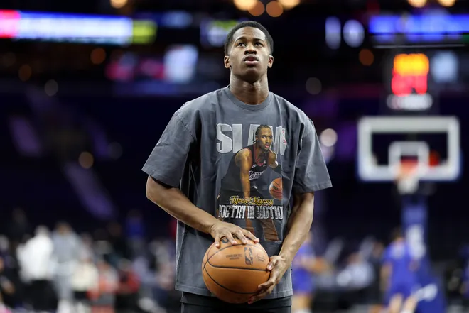 Feb 11, 2026; Philadelphia, Pennsylvania, USA; Philadelphia 76ers guard Vj Edgecombe warms up wearing a shirt depicting Tyrese Maxey before action against the New York Knicks at Xfinity Mobile Arena. Mandatory Credit: Bill Streicher-Imagn Images