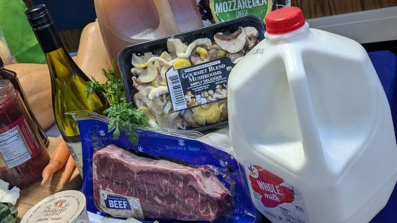 Groceries including beef, milk, mushrooms, and other food products are displayed. Photo: Christina Lengyel / The Center Square