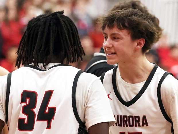 Aurora Christian's Luke Baumann (15) celebrates with Jalen Callaway (34) after his fourth quarter basket against Prophetstown during a Class 2A Aurora Christian Regional semifinal game in Aurora on Wednesday, Feb. 25, 2026.H. Rick Bamman / For the Beacon-News