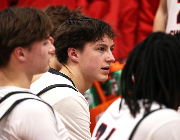 Aurora Christian's Luke Baumann (15) listens to coach Dan Beebe during a fourth quarter time out during a Class 2A Aurora Christian Regional semifinal game against Prophetstown in Aurora on Wednesday, Feb. 25, 2026.H. Rick Bamman / For the Beacon-News