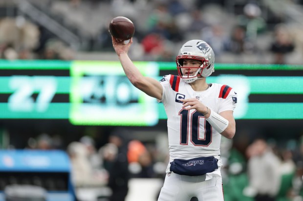 New England Patriots quarterback Drake Maye (10) passes against the New York Jets during the second half of an NFL football game, Sunday, Dec. 28, 2025, in East Rutherford, N.J. (AP Photo/Adam Hunger)