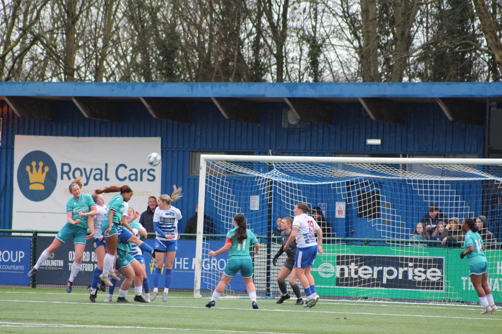 Keziah Banduka puts a header just over the bar