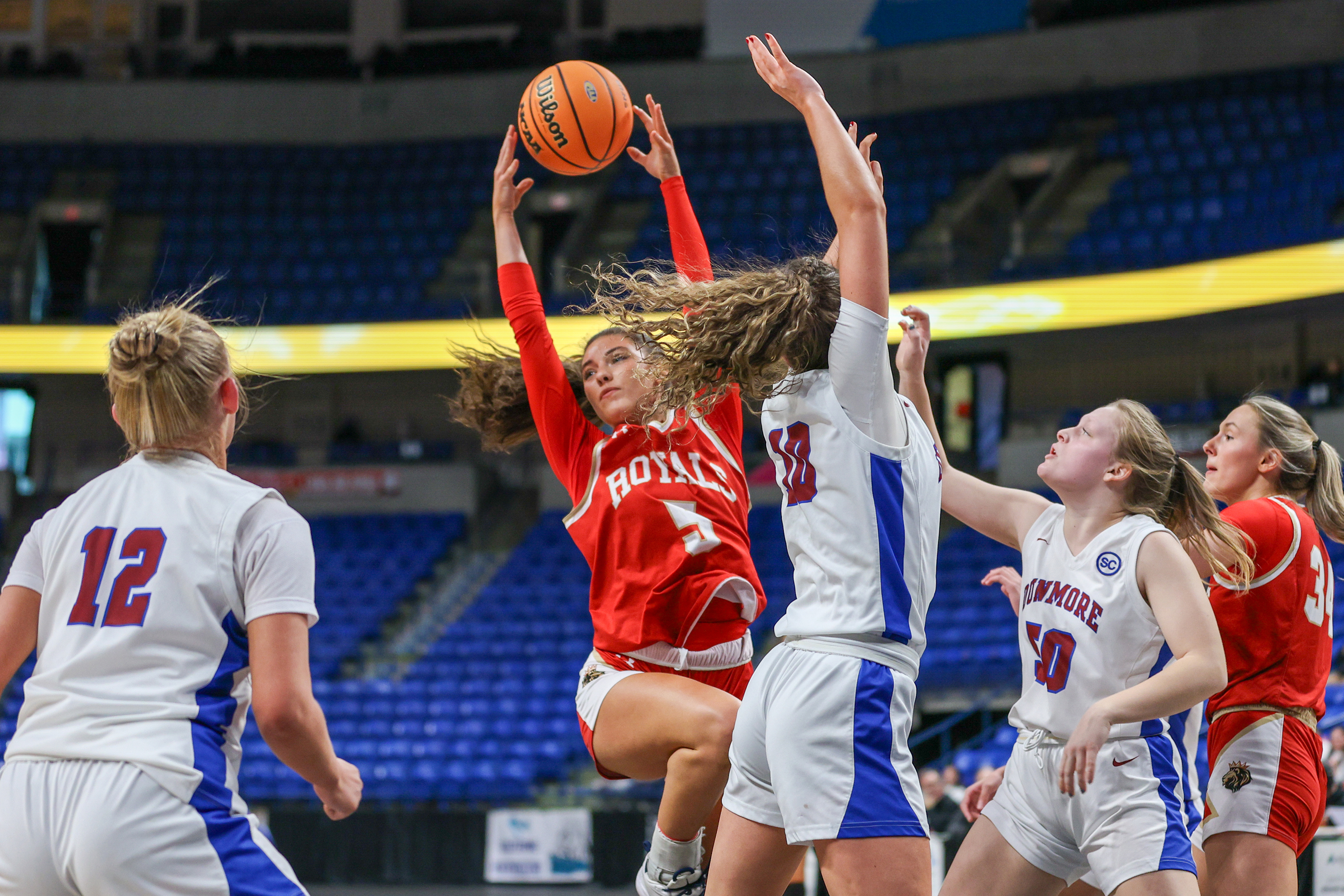 Holy Redeemer’s Bella Boylan (5) grabs a rebound during the...