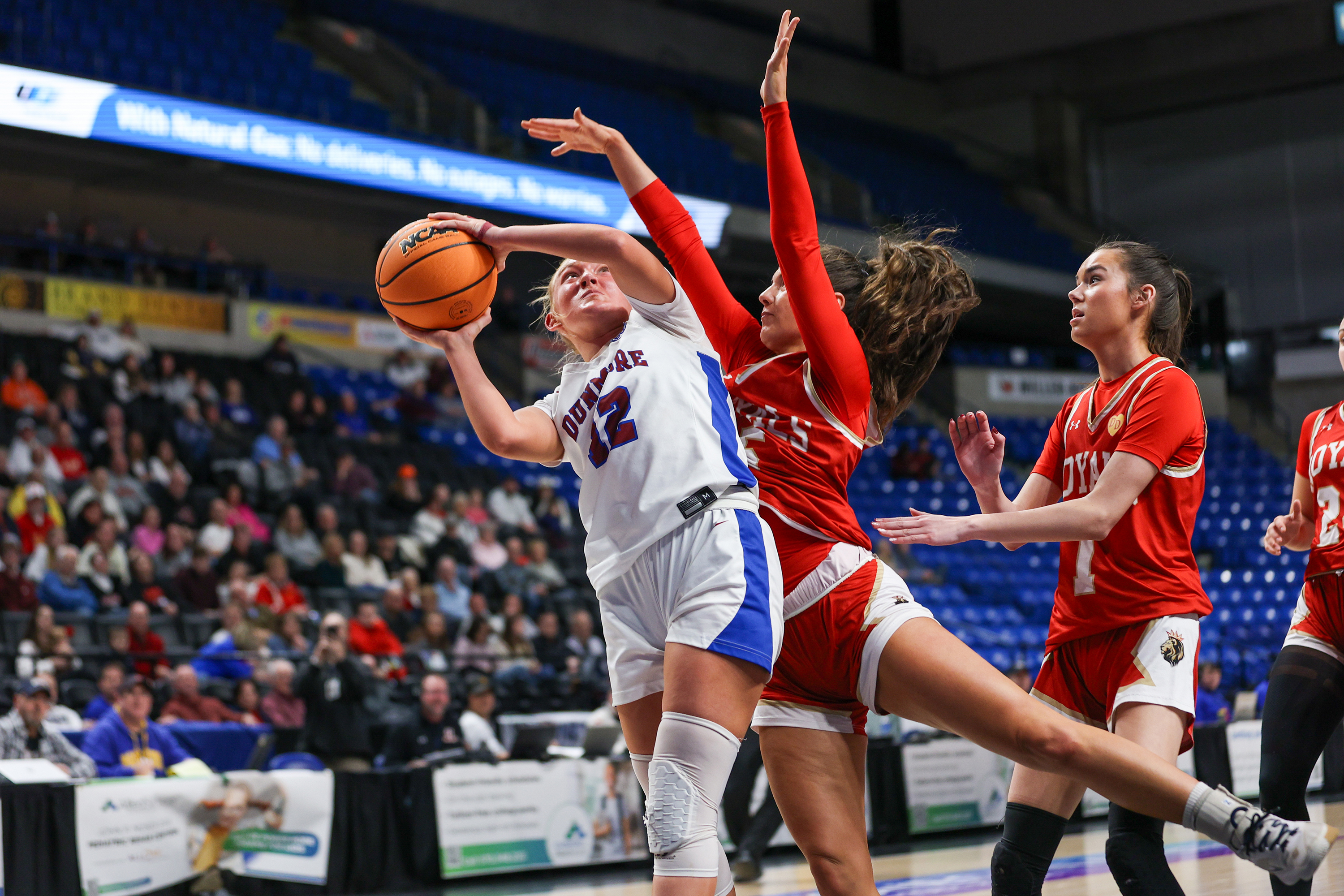Dunmore’s Leena Conte (12) takes a shot as Holy Redeemer’s...
