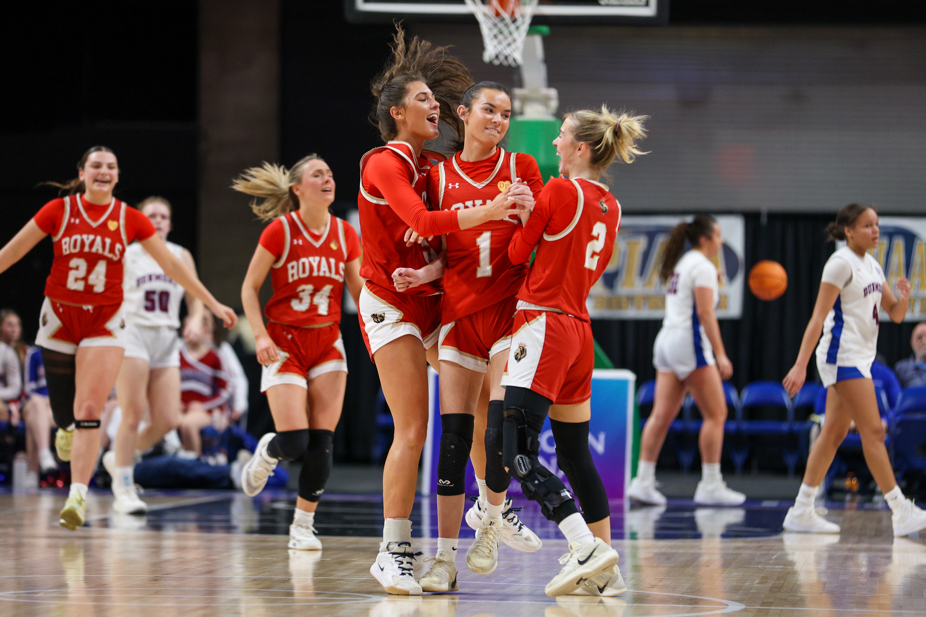 Holy Redeemer celebrates after Kearney Quinn (1) made a three-point...