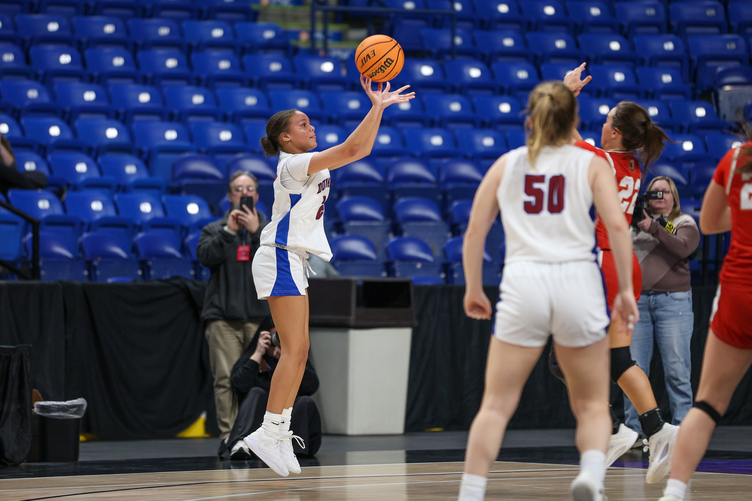 Dunmore’s Janaya Martin (2) takes a three-point shot to put...