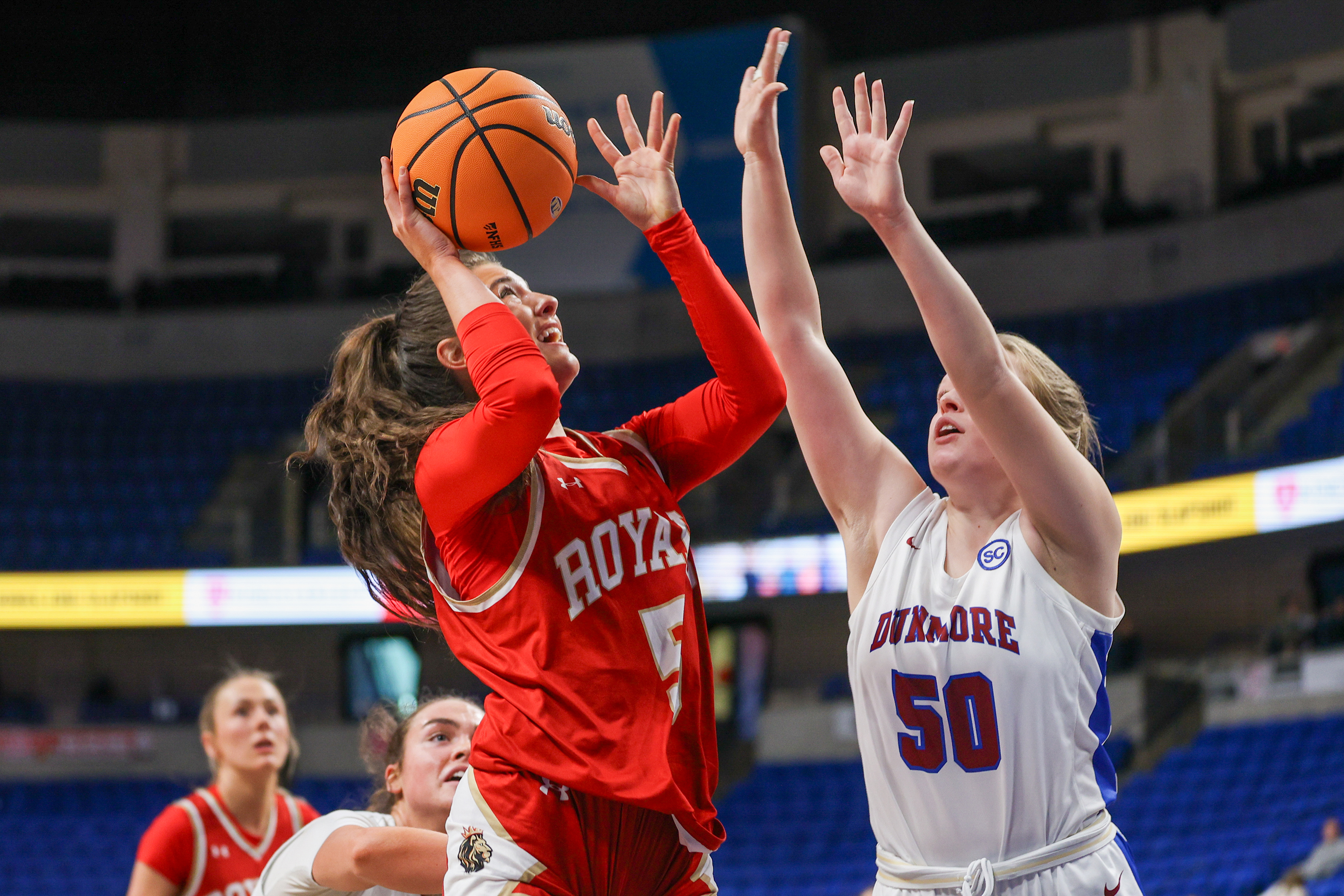 Holy Redeemer’s Bella Boylan (5) shoots a layup as Dunmore’s...