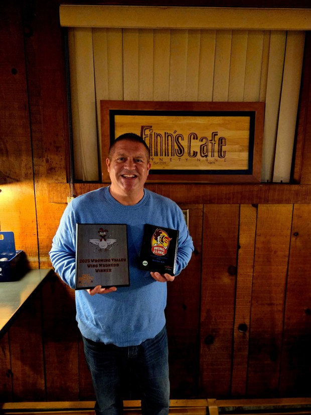 Jimmy Finn, owner of Finn's Cafe 99 in Wilkes-Barre, shows of last year award for winning inaugural Chicken Wing Madness voting contest organized by the NEPA Chicken Wing Bulletin. (Courtesy of Finn's Cafe 99)