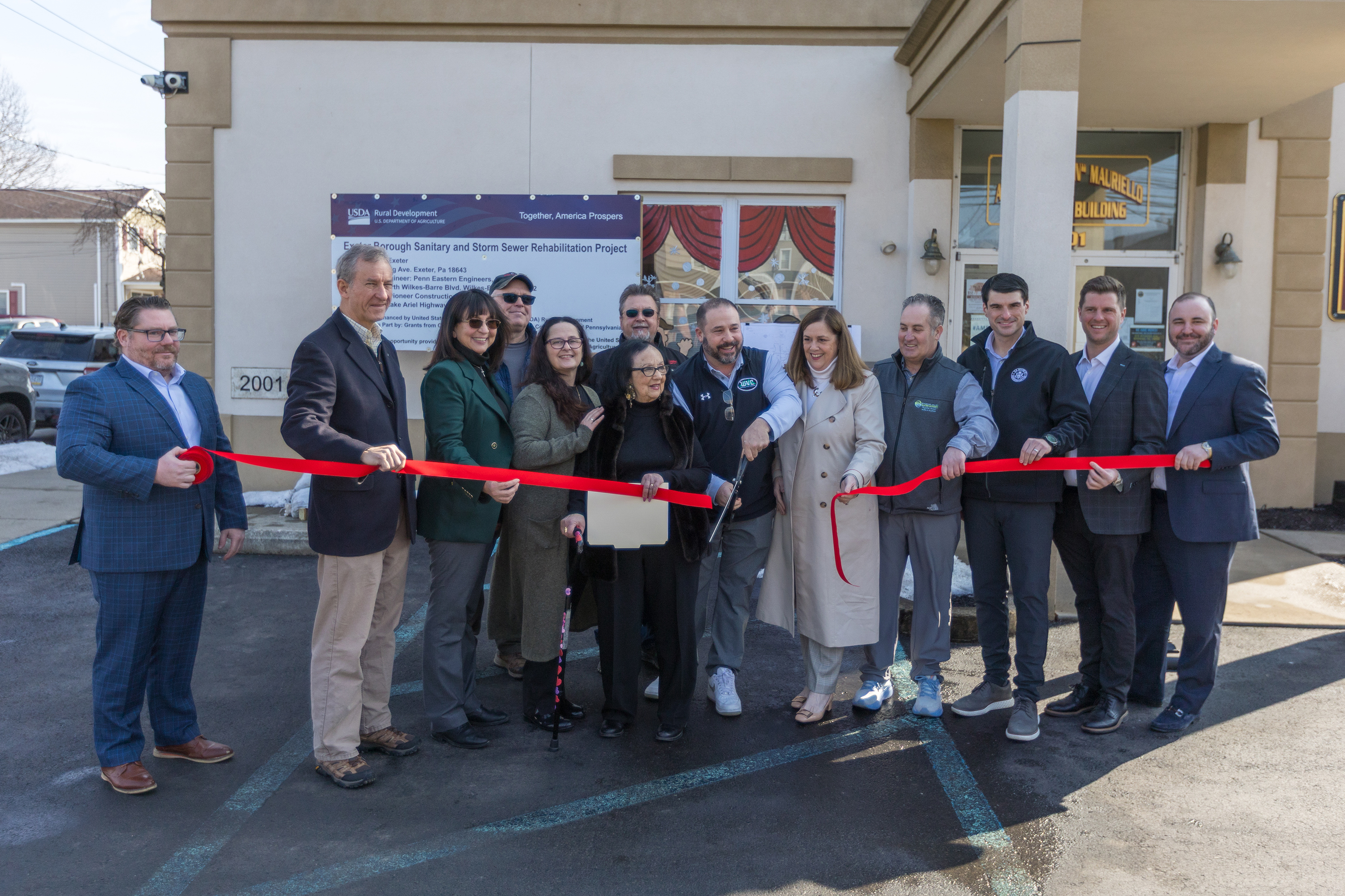 Current and former lawmakers cut the ribbon during the groundbreaking...