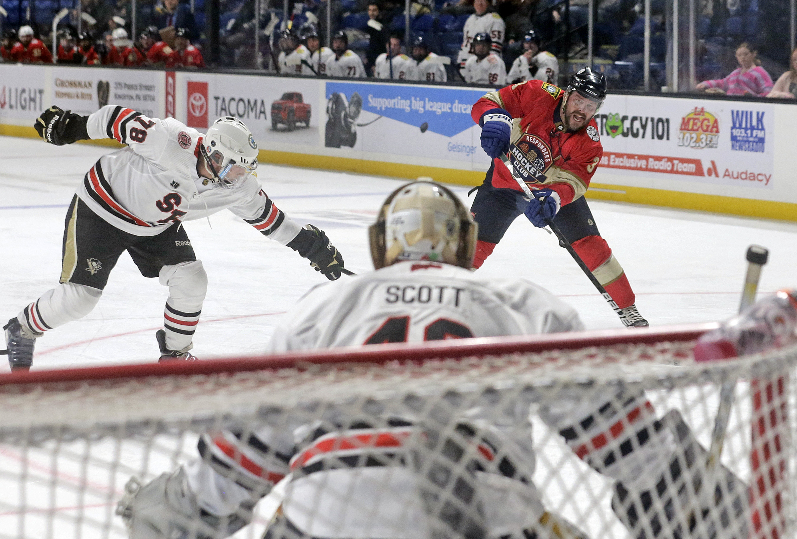 Wilkes-Barre’s Brian Mock (3) shoots against Scranton goalkeeper Jim Scott...