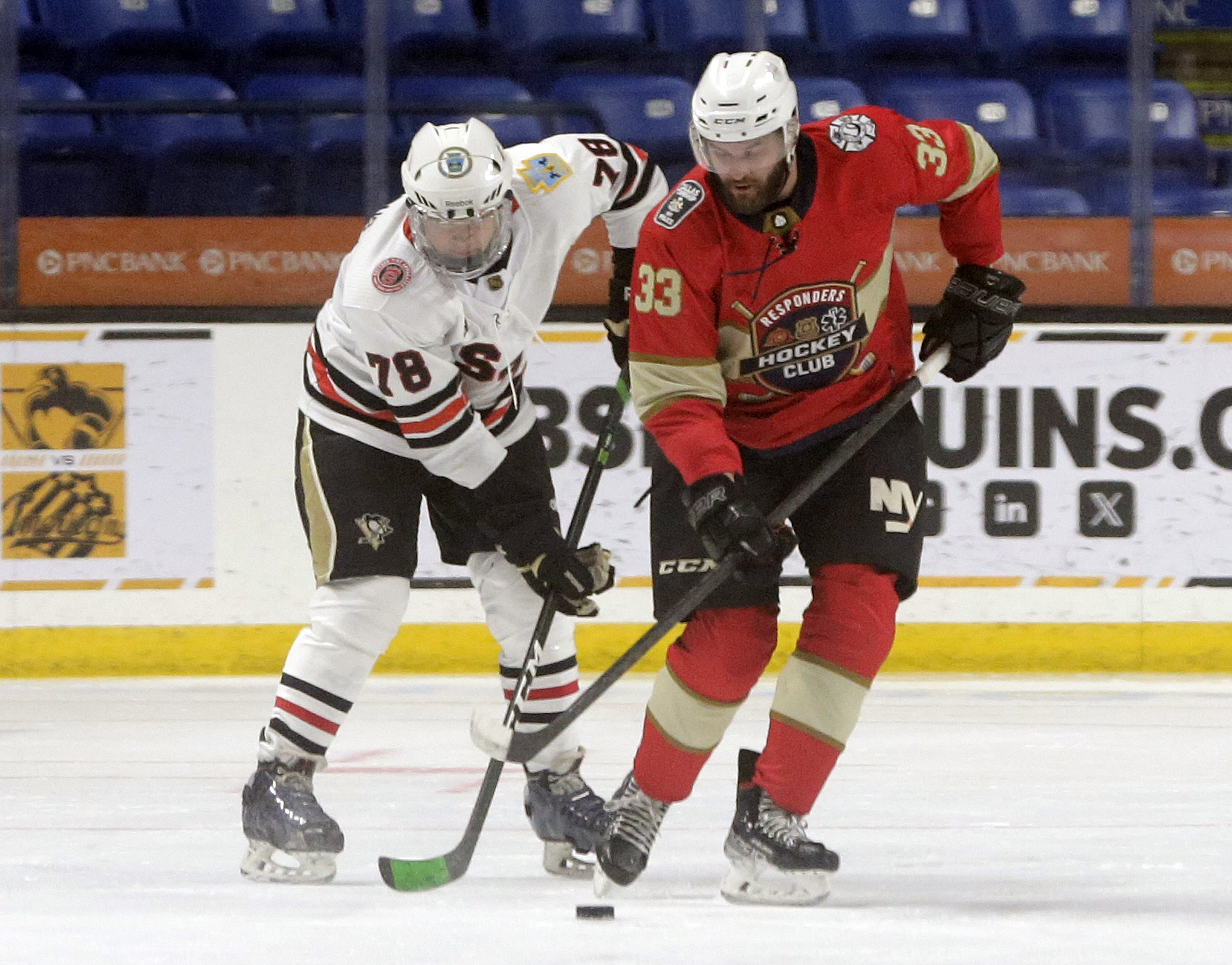 Scranton’s Rob Hegedus, left, and Wilkes-Barre’s Kevin Mass battle for...