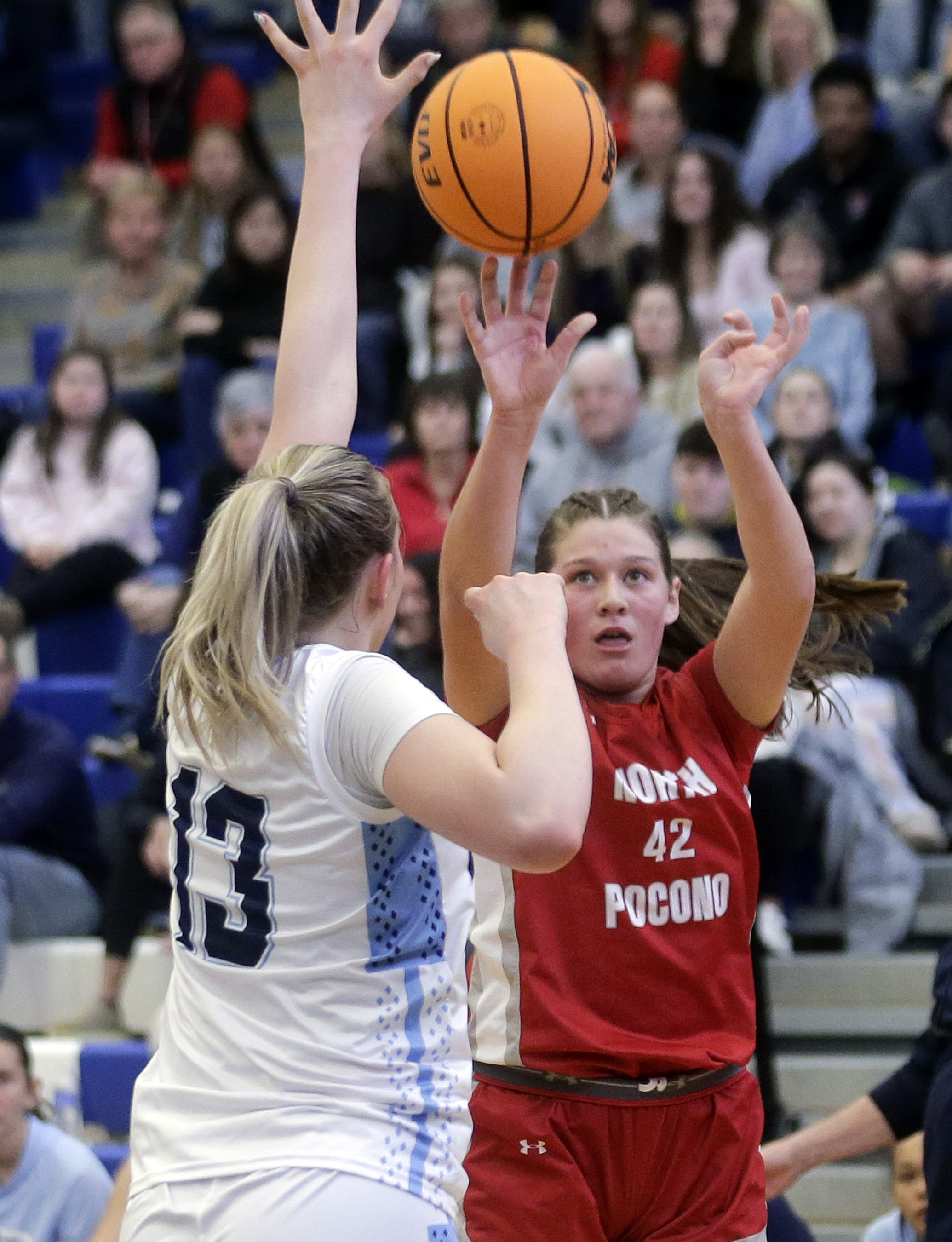 North Pocono’s Anna Clementoni, right, shoots a three-pointer over Dallas’...