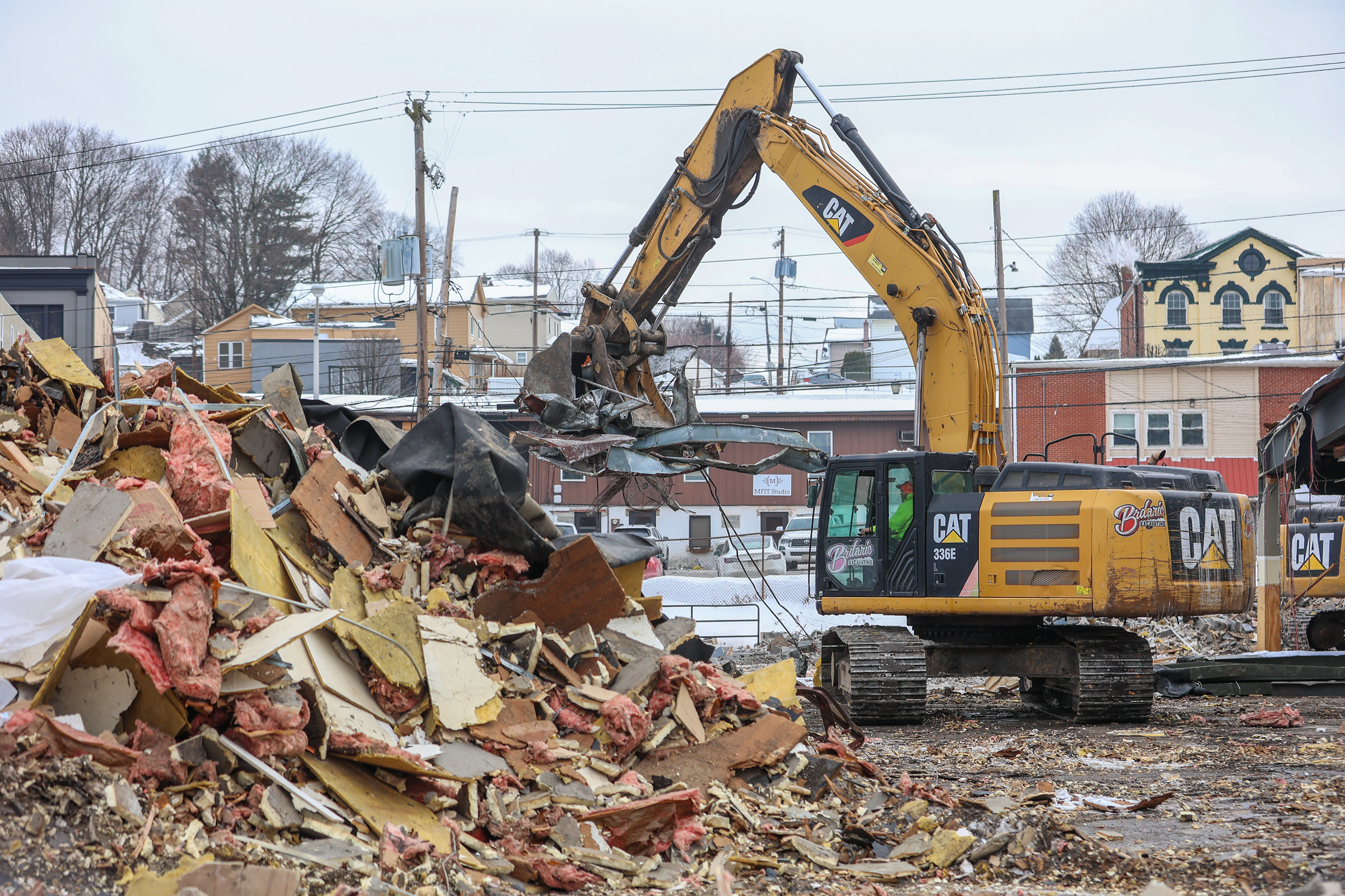 Two cranes demolish the former Quinn’s Supermarket in Pittston on...