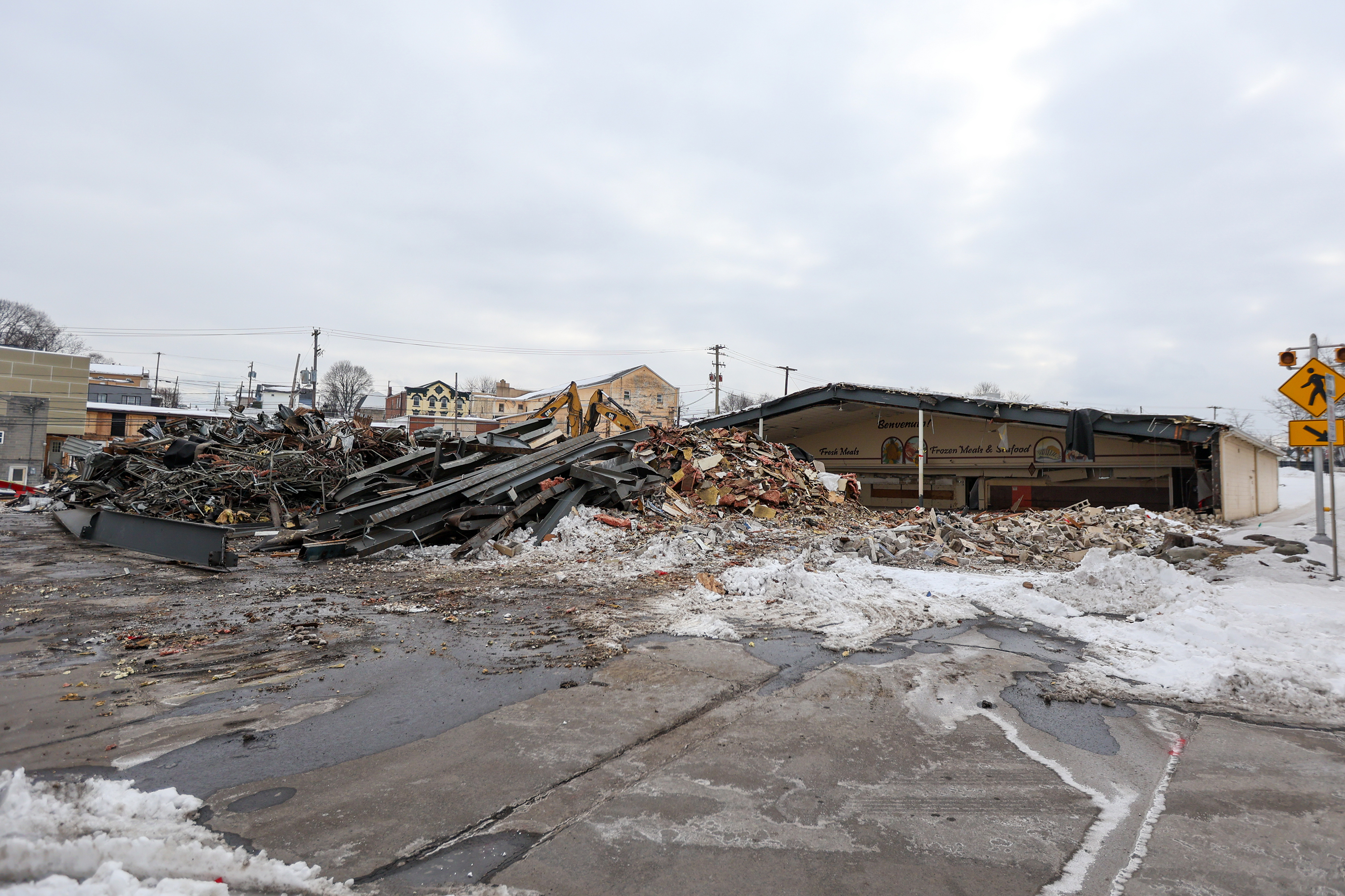 Two cranes demolish the former Quinn’s Supermarket in Pittston on...