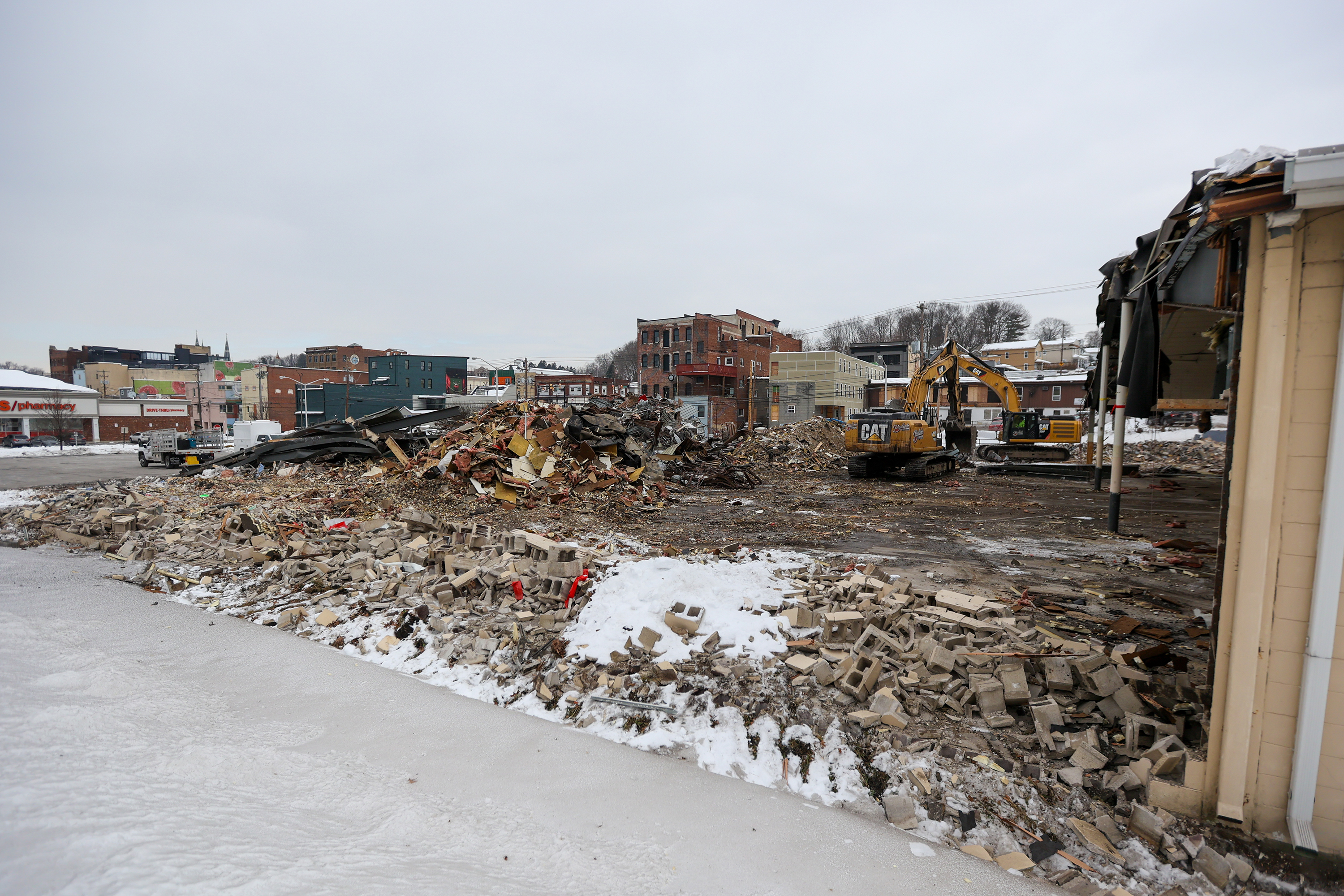 Two cranes demolish the former Quinn’s Supermarket in Pittston on...