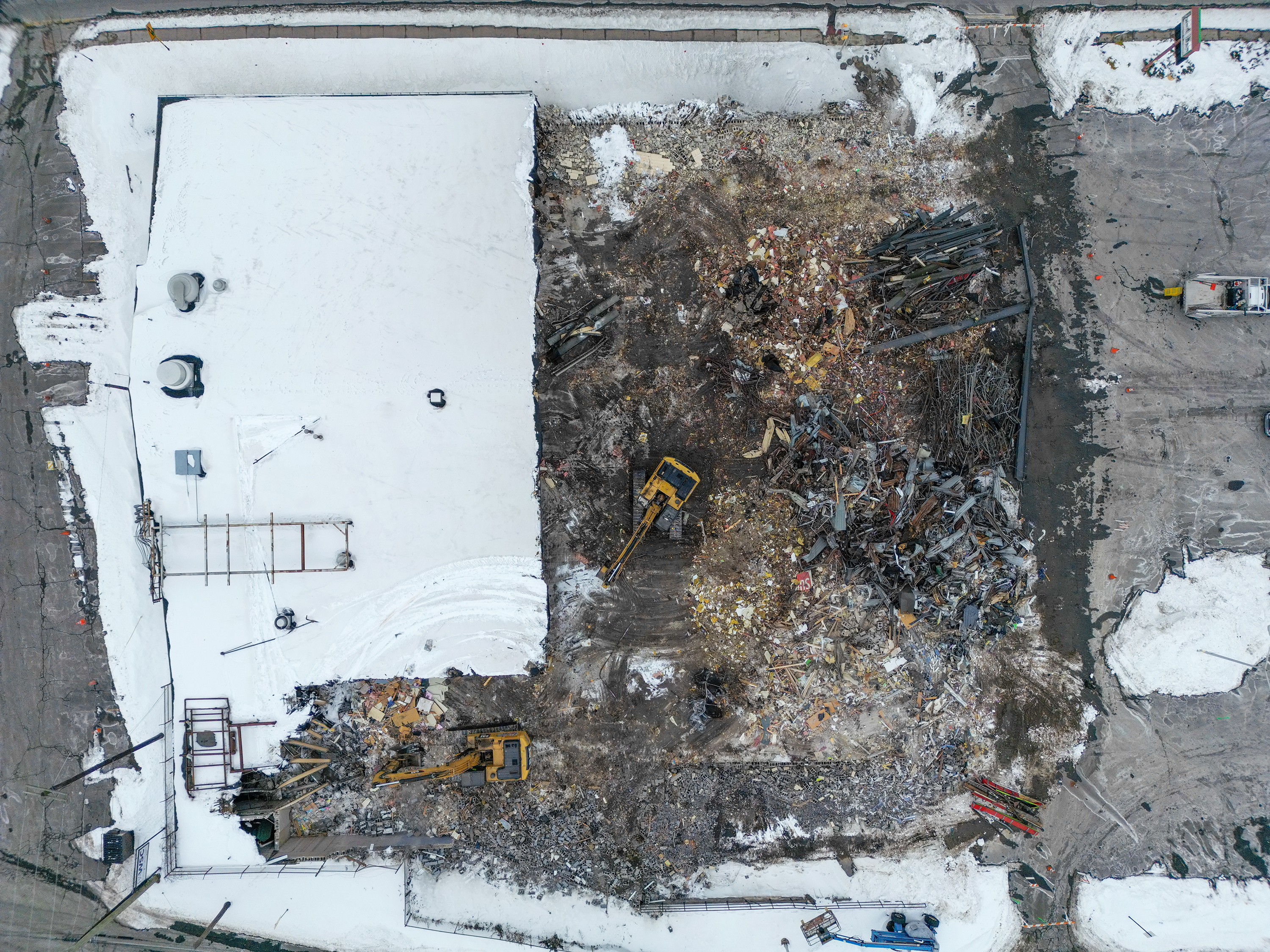 Two cranes demolish the former Quinn’s Supermarket in Pittston on...