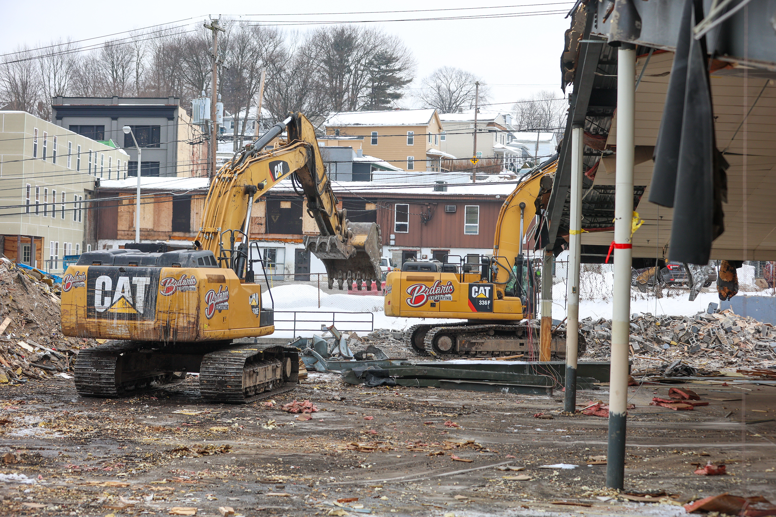 Two cranes demolish the former Quinn’s Supermarket in Pittston on...