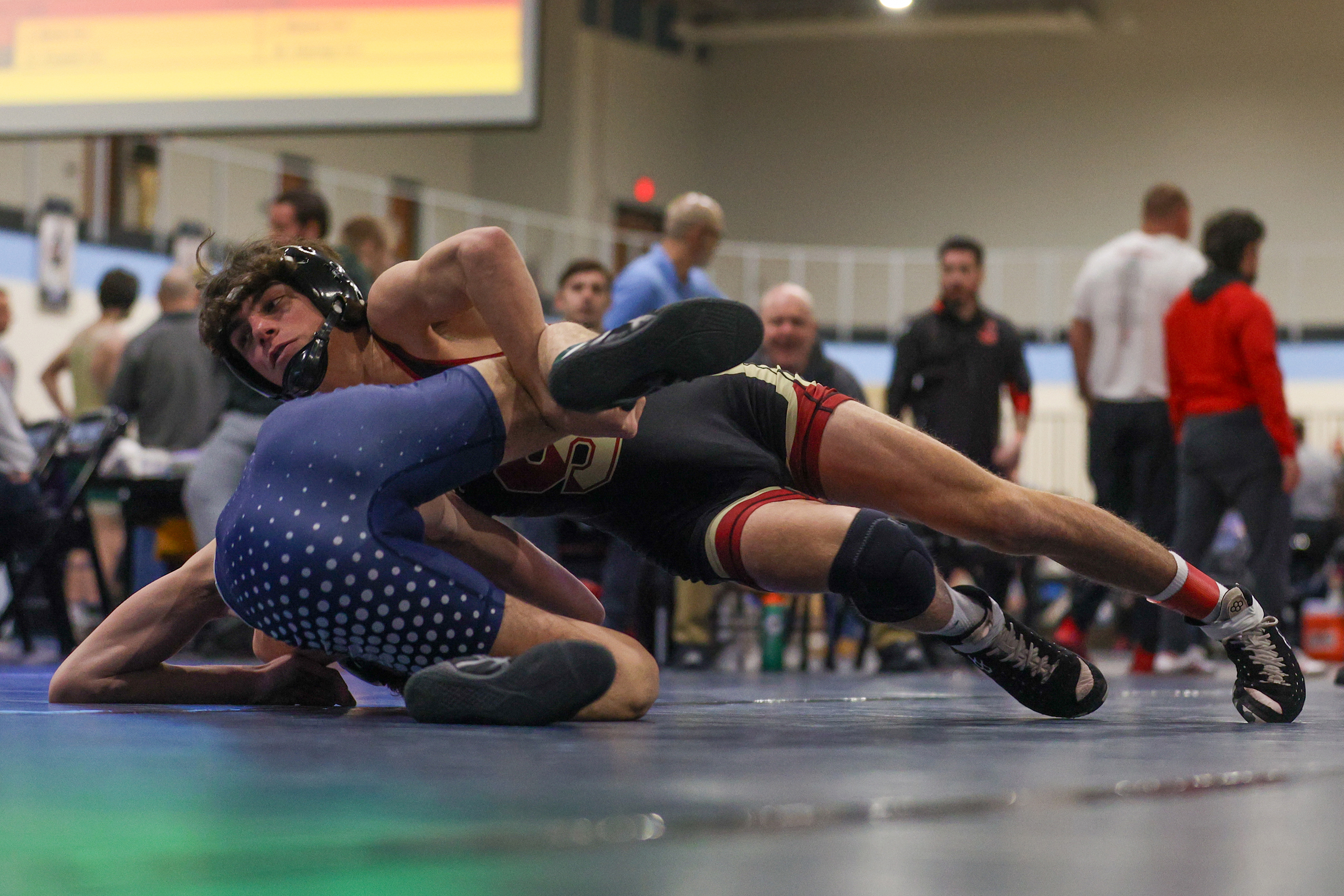 Scranton’s Drew Leonori wrestles Abington Heights’ Justin Kizer during the...