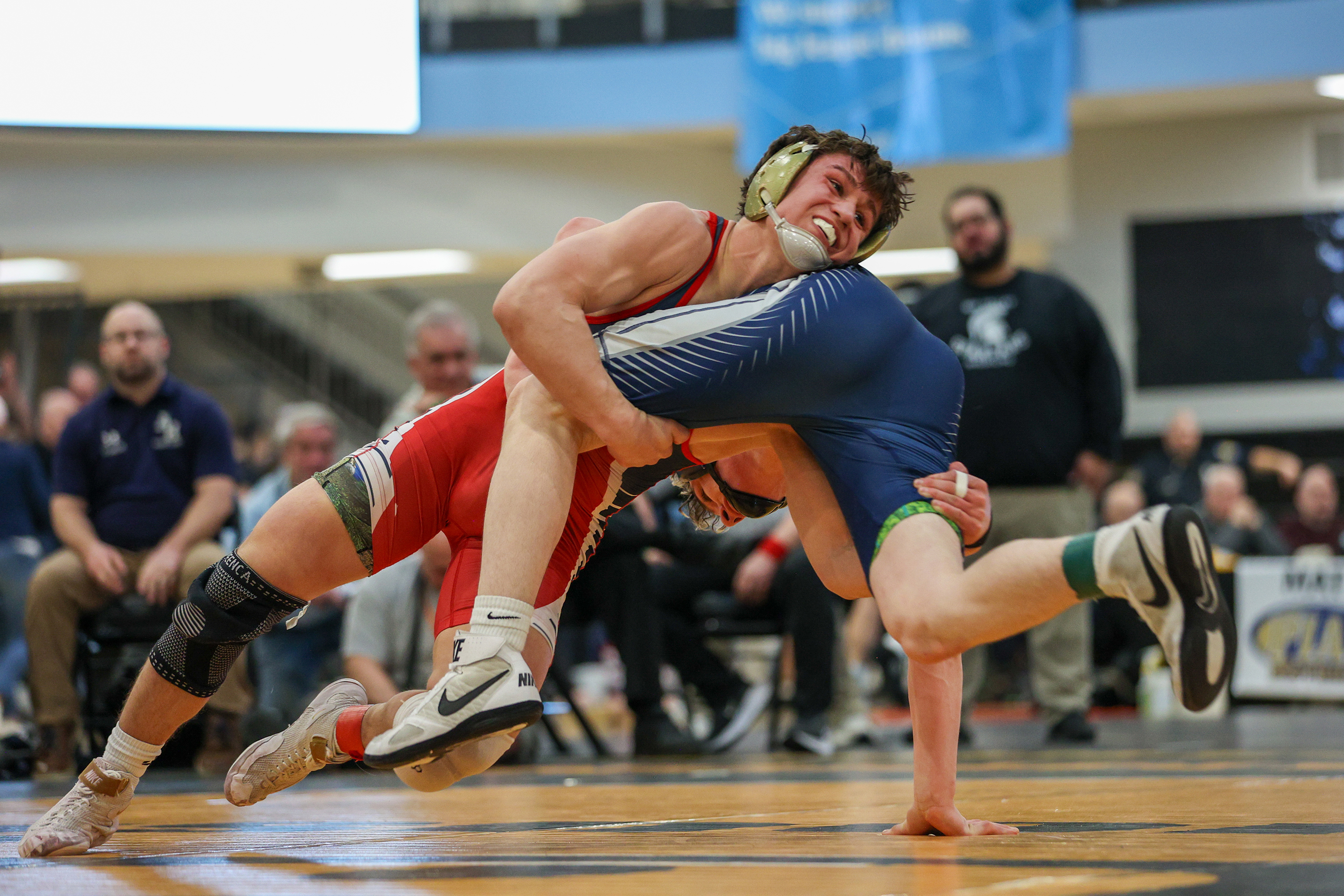 Pittston Area’s Ethan Aftewicz wrestles Abington Heights’ Lucas Drake during...