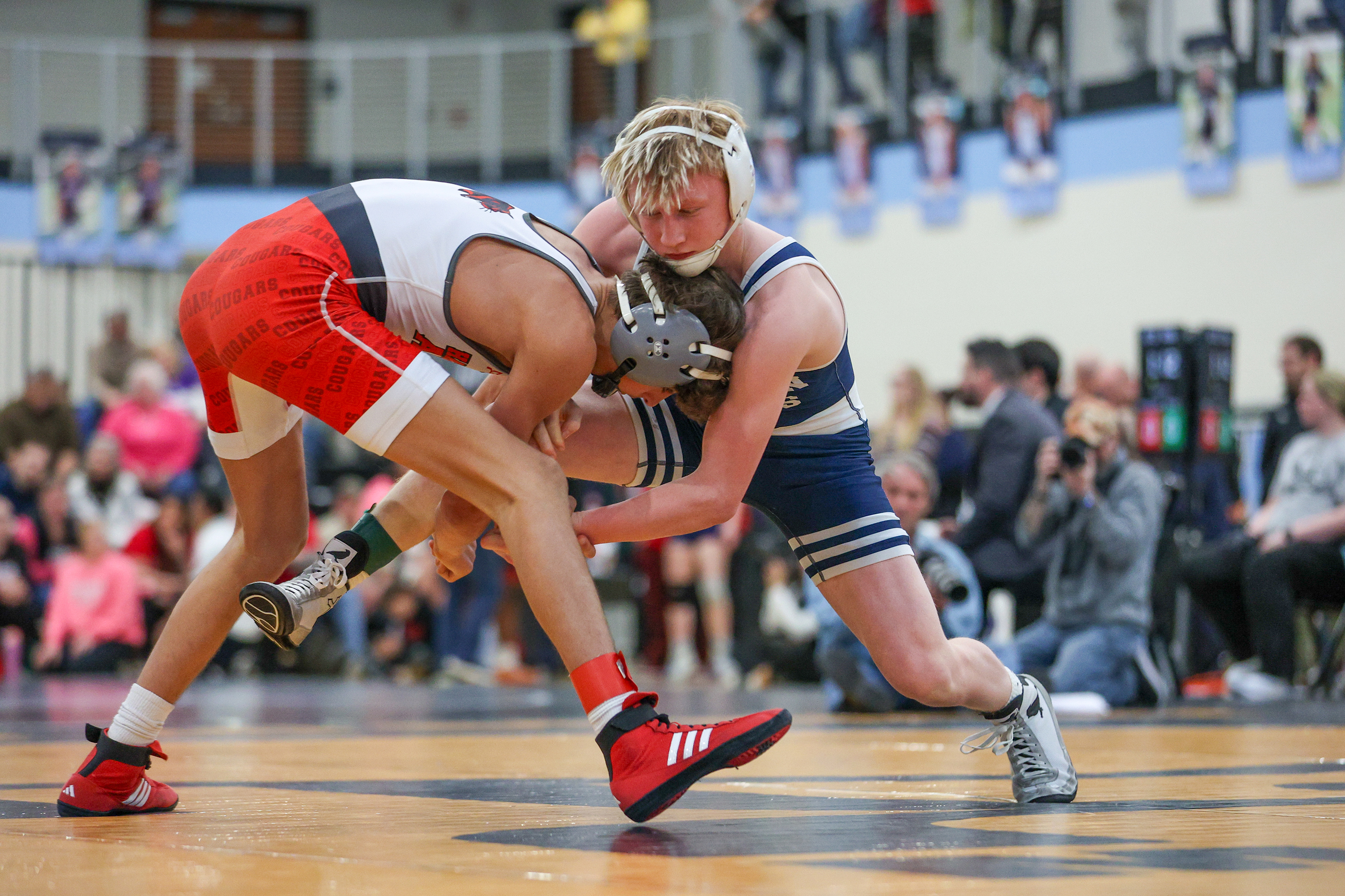 Abington Heights’ Dakota Sandy, right, wrestles Hazleton Area’s Gabe Benyo...