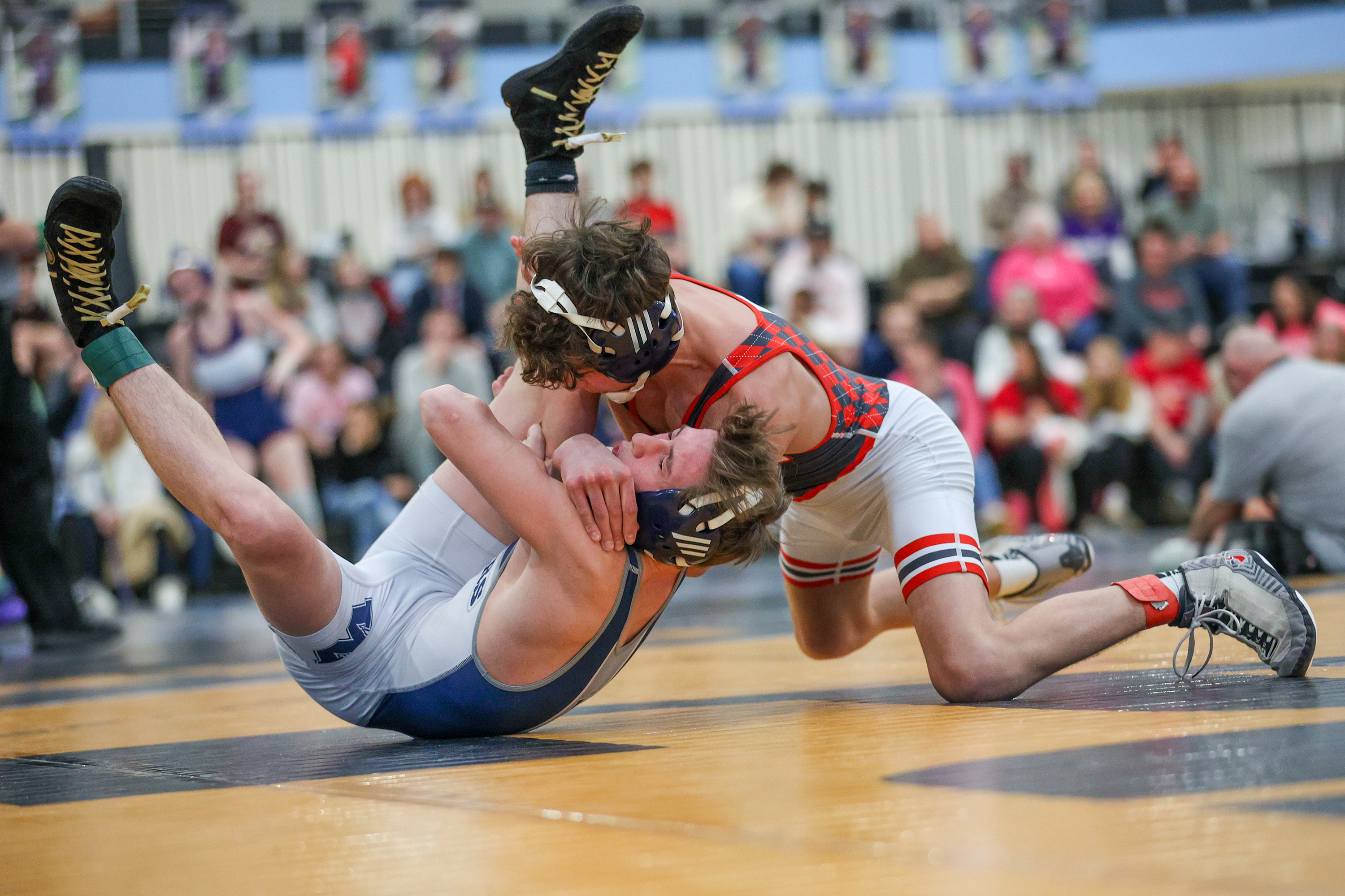 Hazleton Area’s Jake Benyo wrestles West Scranton’s Santino Aniska during...