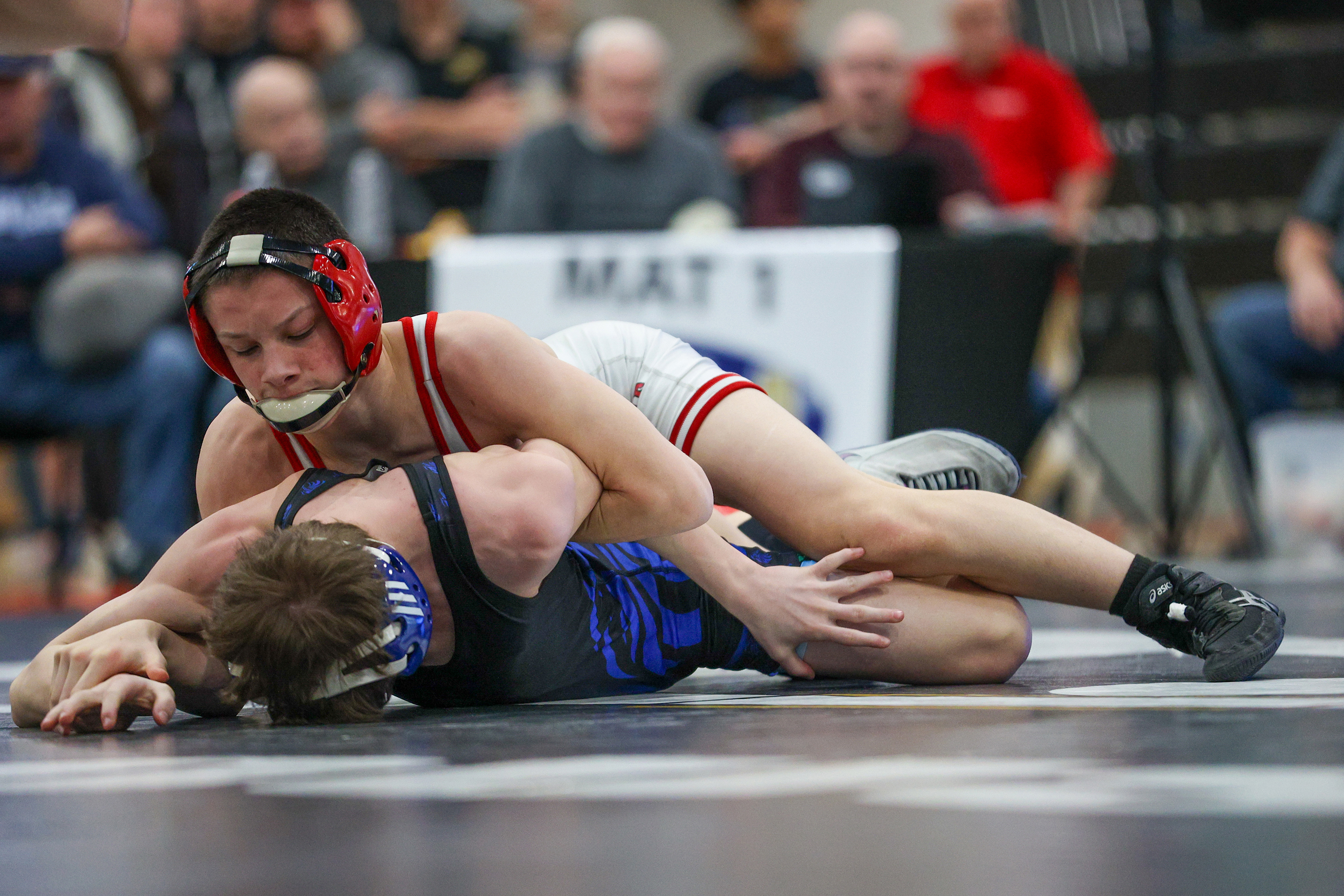 Honesdale’s Nathan Schuman holds down Hanover Area’s Nate Clime during...