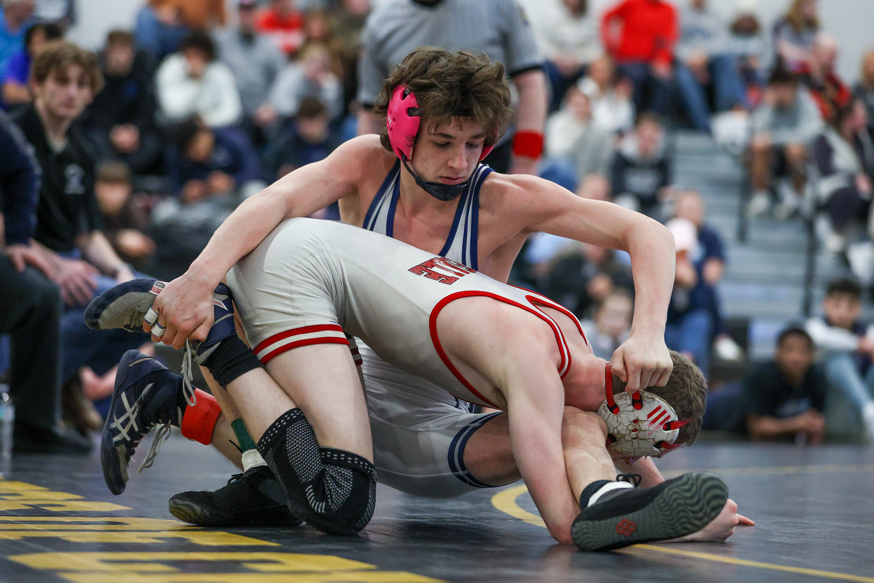 Berwick’s Carmen Malt wrestles Honesdale’s Brody Walsh during the PIAA...