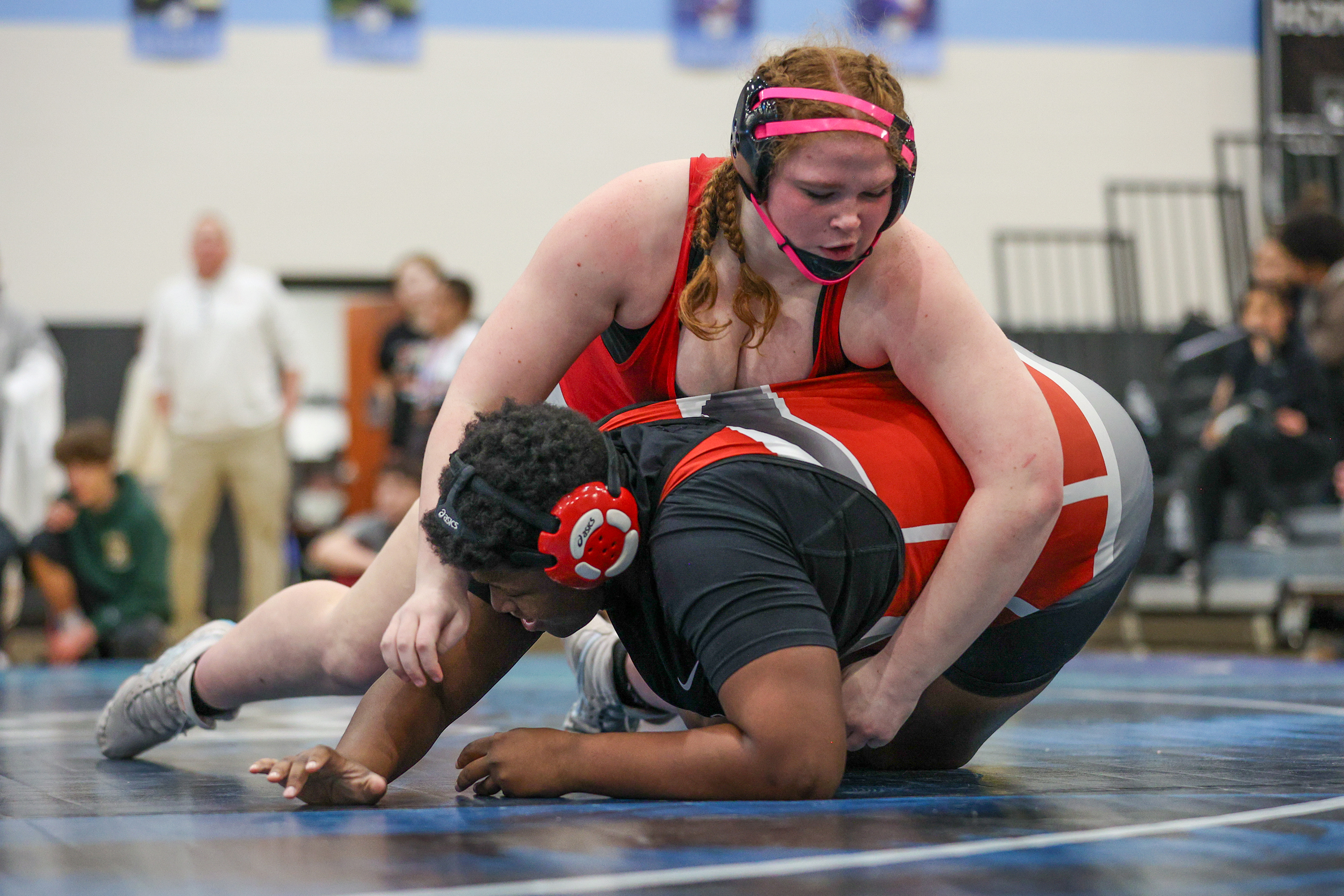 Hazleton’s Evelyn Sheer holds down Crestwood’s Samara Bailey during the...