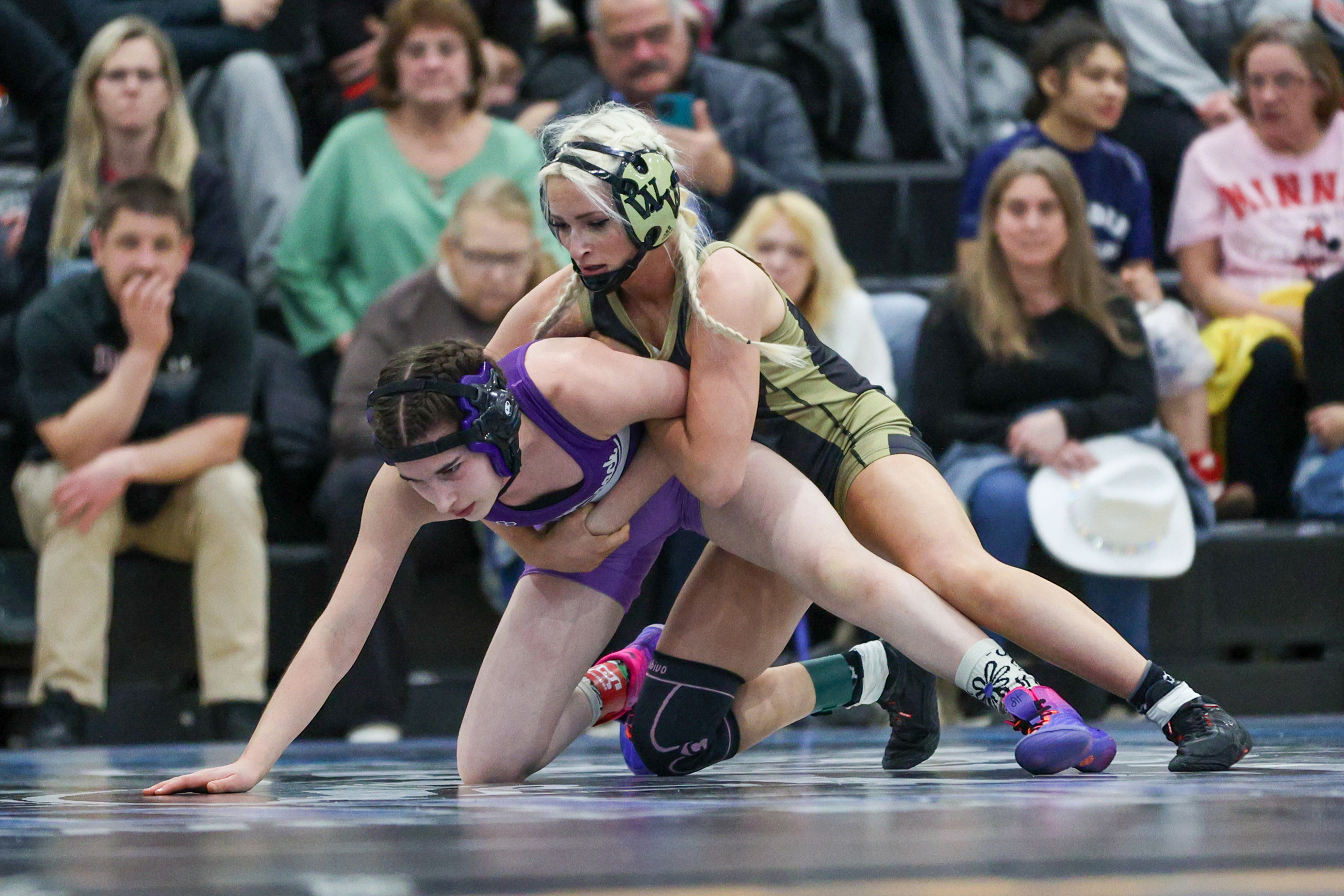 Western Wayne’s Mia Gifford holds down Wallenpaupack’s Rosa SanClementi during...
