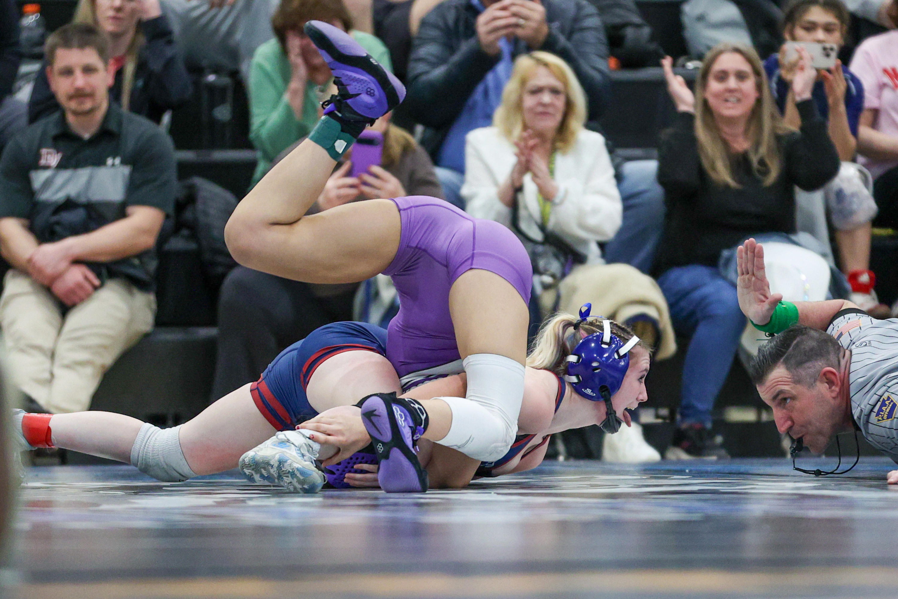 Nanticoke’s Emily Kivler celebrates as she defeats Wallenpaupack’s Gia Silva...