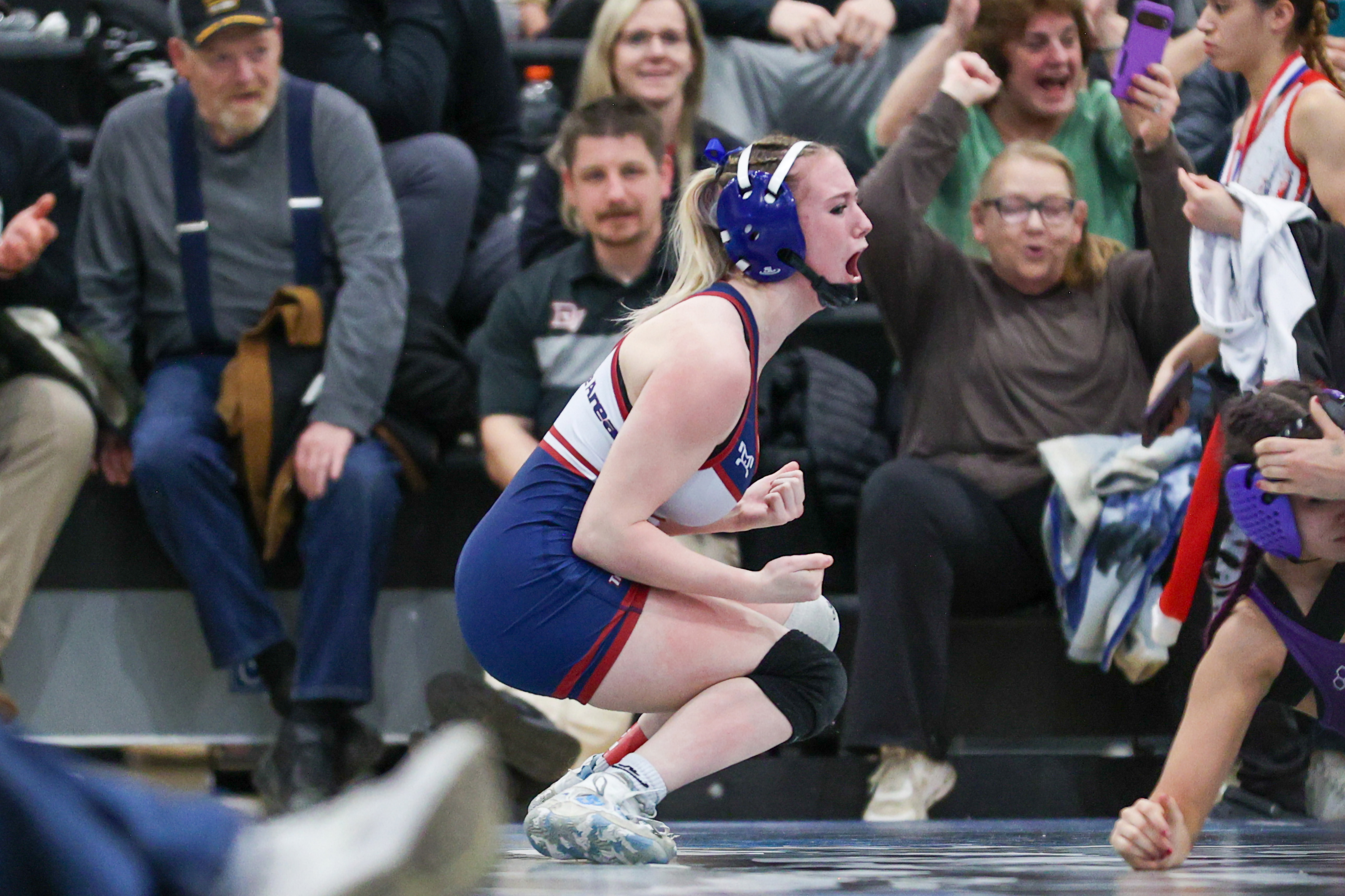 Nanticoke’s Emily Kivler celebrates after defeating Wallenpaupack’s Gia Silva during...