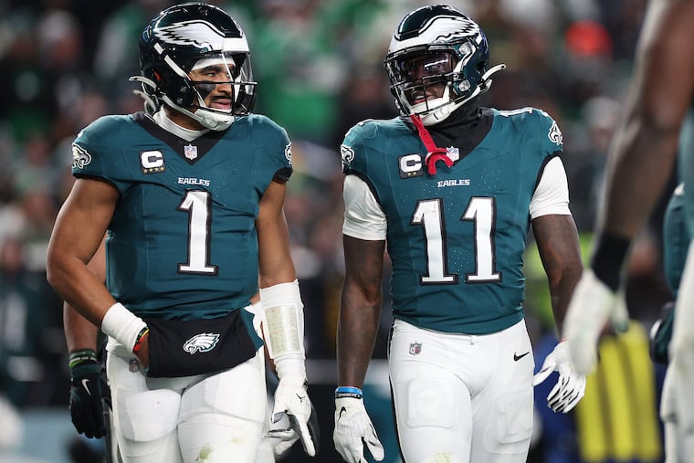 Philadelphia Eagles quarterback Jalen Hurts (left) and A.J. Brown talk in 2024, happier times.