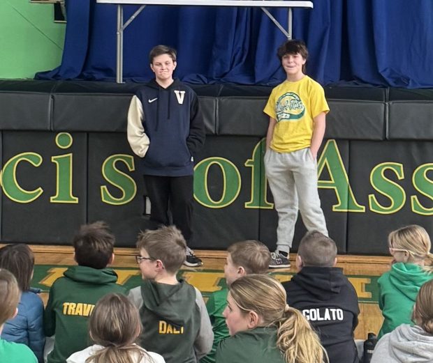 Seventh grade student Max Travea, left, and his big brother eighth grader Sam Travea competed in the St. Francis of Assisi Religion Bee during the recent Catholic School Week. They were the last two contestants standing. (COURTESY OF THE TRAVEA FAMILY)