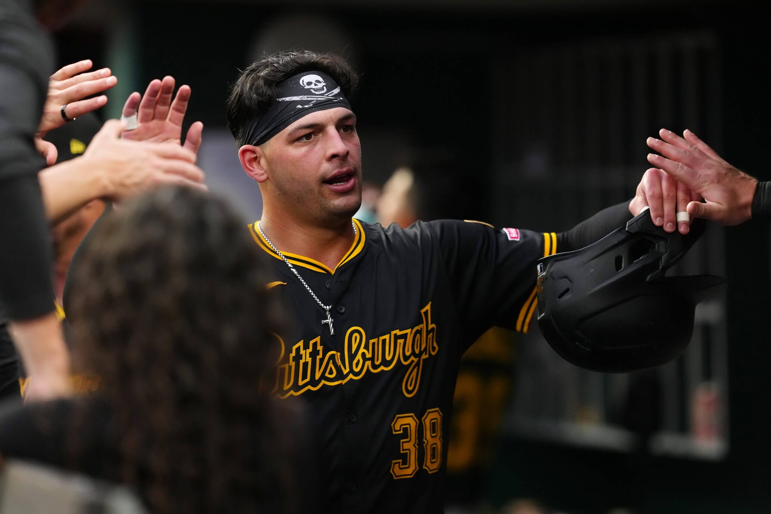 Nick Yorke #38 of the Pittsburgh Pirates celebrates with teammates after scoring a run in the second inning against the Cincinnati Reds at Great American Ball Park.