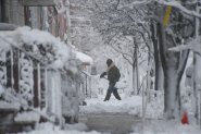 PHILADELPHIA, PENNSYLVANIA - FEBRUARY 23: Residents in Philadelphia dig out their cars as heavy snow continues to fall on February 23, 2026 in Philadelphia, Pennsylvania. A Nor'Easter brought over a foot of snow to some areas along the east coast impacting travel throughout the region, with snow continuing until the afternoon. (Matthew Hatcher/Getty Images)