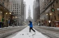 PHILADELPHIA, PENNSYLVANIA - FEBRUARY 23: Residents of Philadelphia brave heavy snow and wind as winter storm conditions continue on February 23, 2026 in Philadelphia, Pennsylvania. A Nor'Easter brought over a foot of snow to some areas along the east coast impacting travel throughout the region, with snow continuing until the afternoon. (Matthew Hatcher/Getty Images)