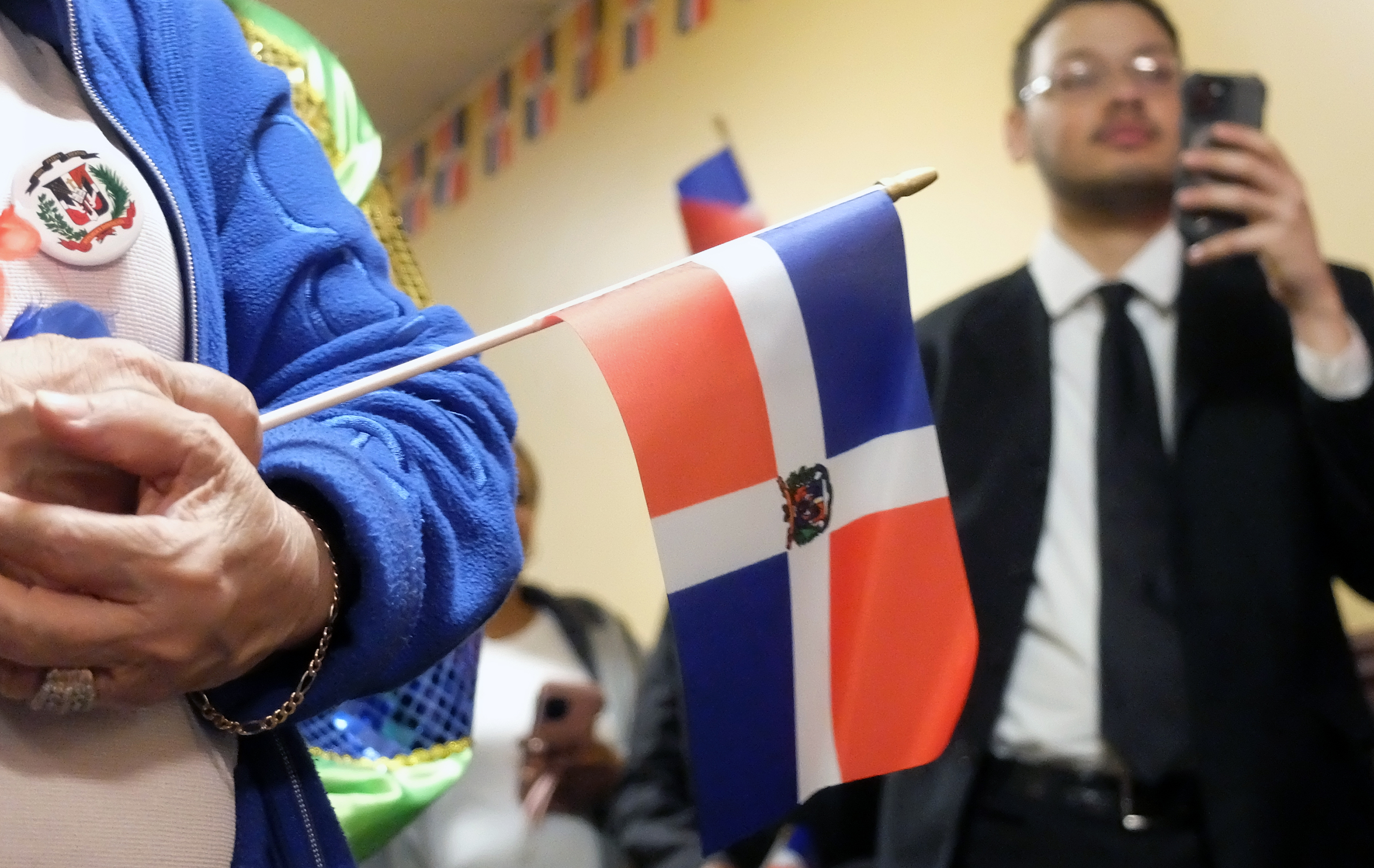 The flag of the Dominican Republic is held during a...