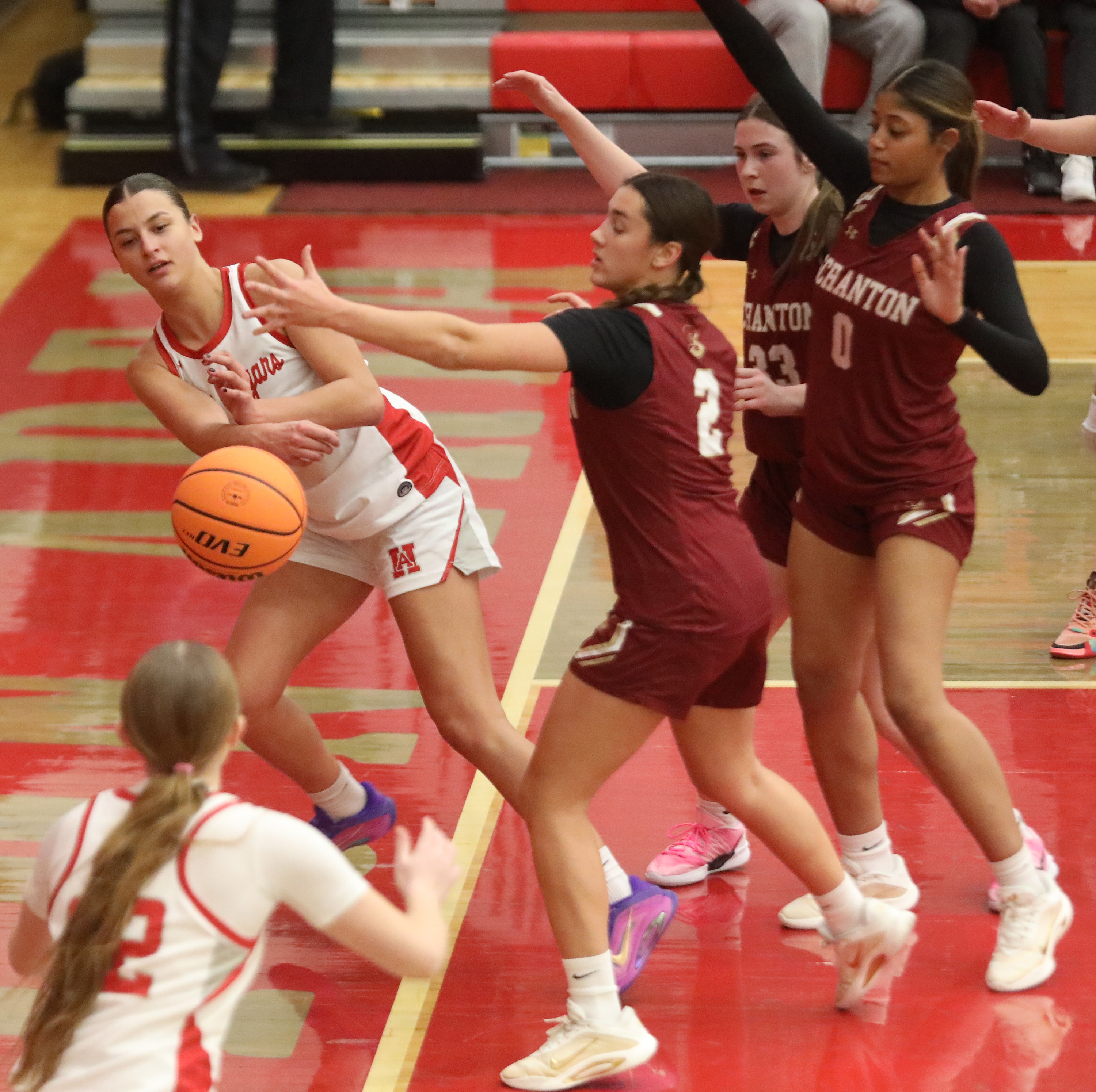 Hazleton Area’s Sophia Benyo (2) makes the pass to teammate...