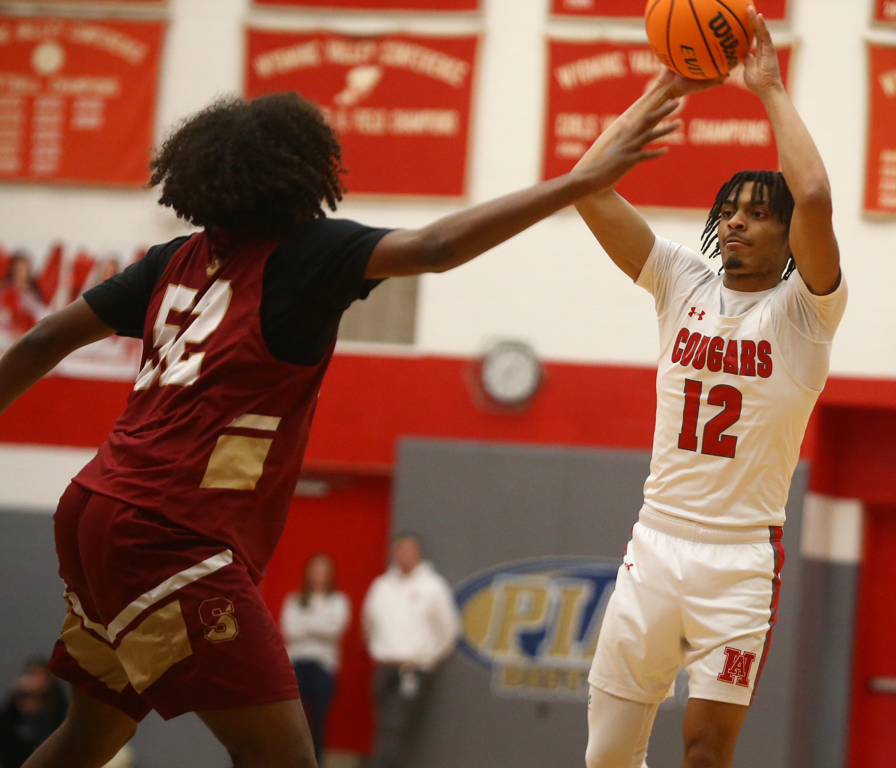 Scranton Justin Mayers (52) pressures Hazleton YoYo Moran(12) as he...