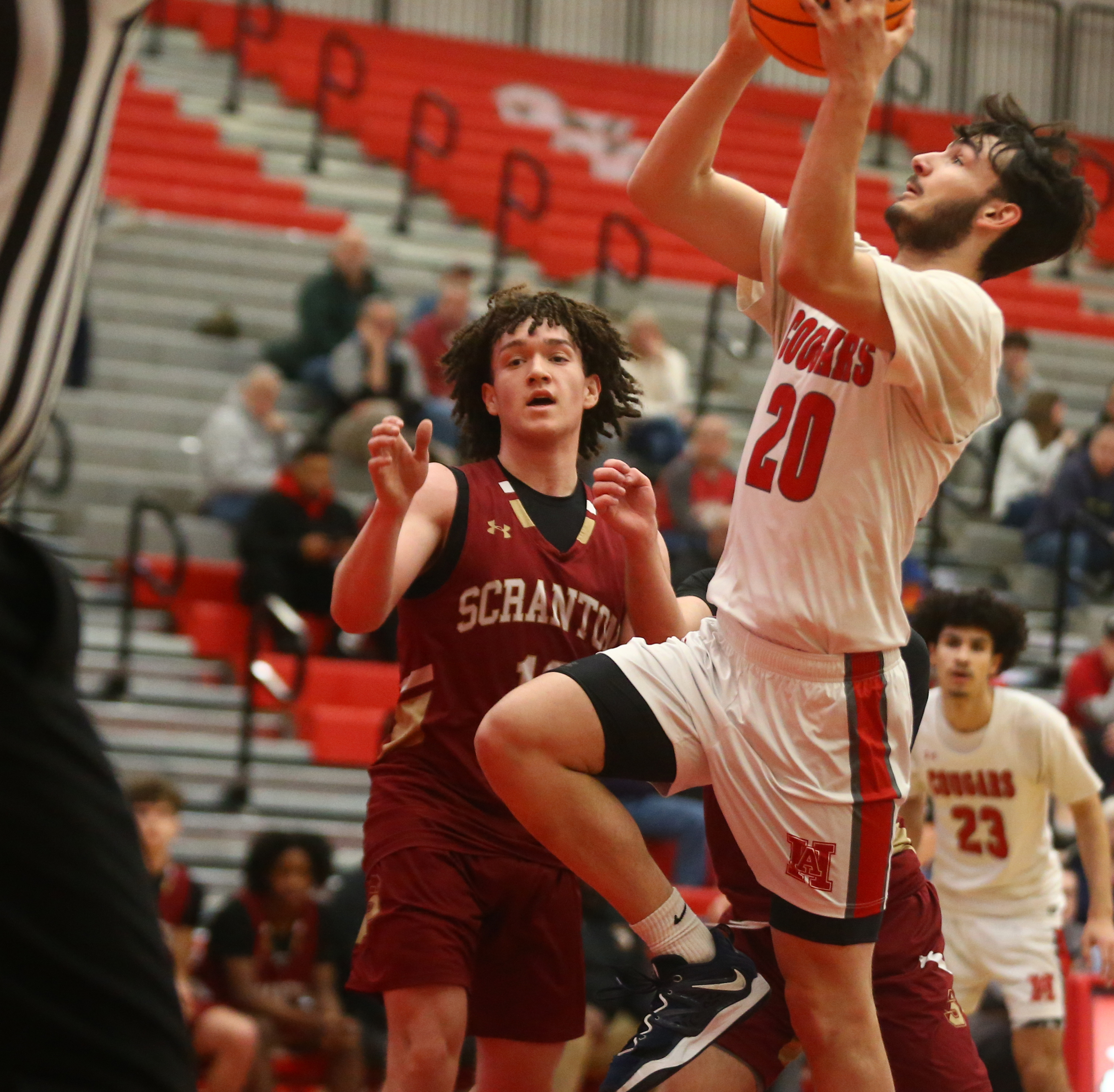 Hazleton Dylan Stish (20) drives up the middle for two...