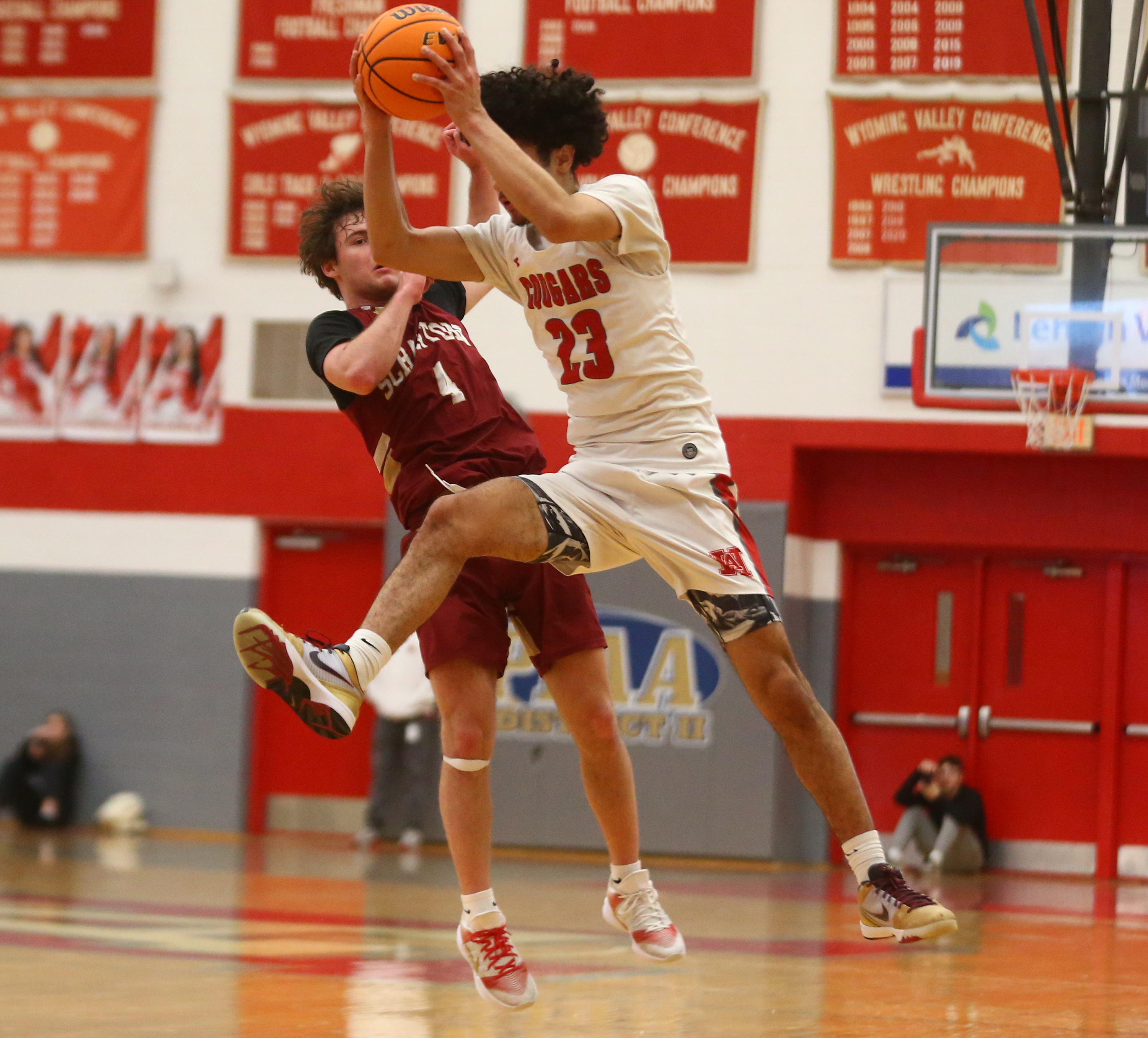 Hazleton Area’s Occandy Vasquez (23) and Scranton’s Tony Battaglia (4)...