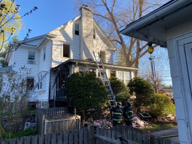 Upper Darby firefighters on the scene of a house fire on Morgan Avenue in Drexel Hill Tuesday. (PETE BANNAN-DAILY TIMES)