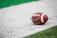 A North Texas football sits on the sideline before an NCAA college football game against...