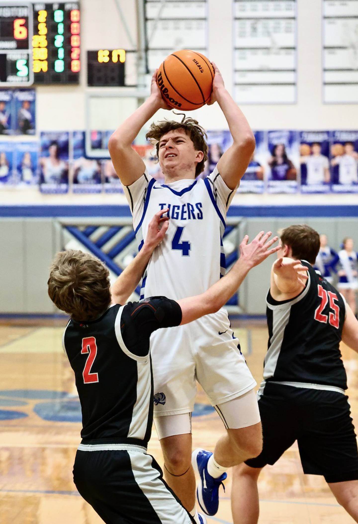 Princeton freshman Julia Mucha shoots over Erie-Prophetstown's Connor Keegan in Tuesday's game at Prouty Gym. The visiting Panthers won 54-46.