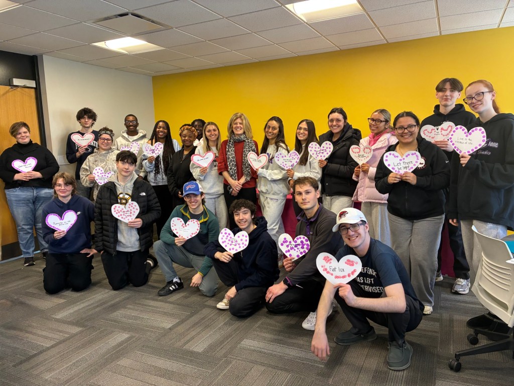 ‘Amor Omnia Vincit,’ Hawk Hill Provost Jean McGivney-Burelle, PhD enjoys convivial moments with SJU Latin students