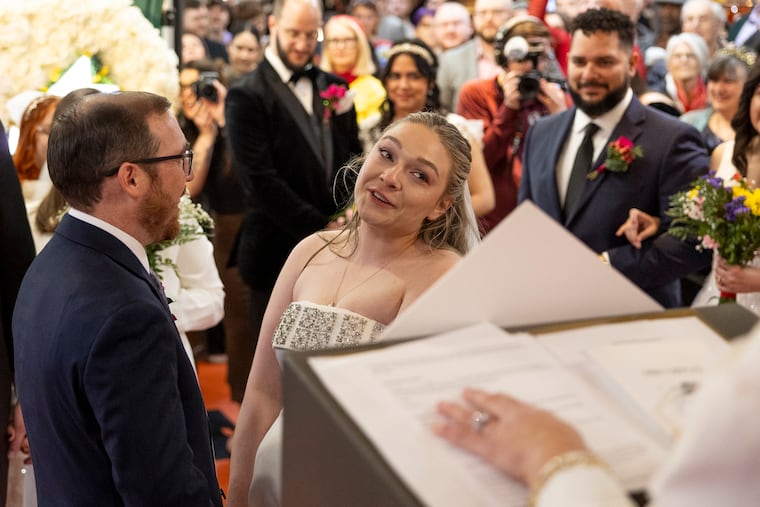 Julia Allison tears up as she marries Tim Vogel of Manayunk at the Reading Terminal Market on Valentine's Day in Philadelphia, Pa., Saturday, Feb. 14, 2026.