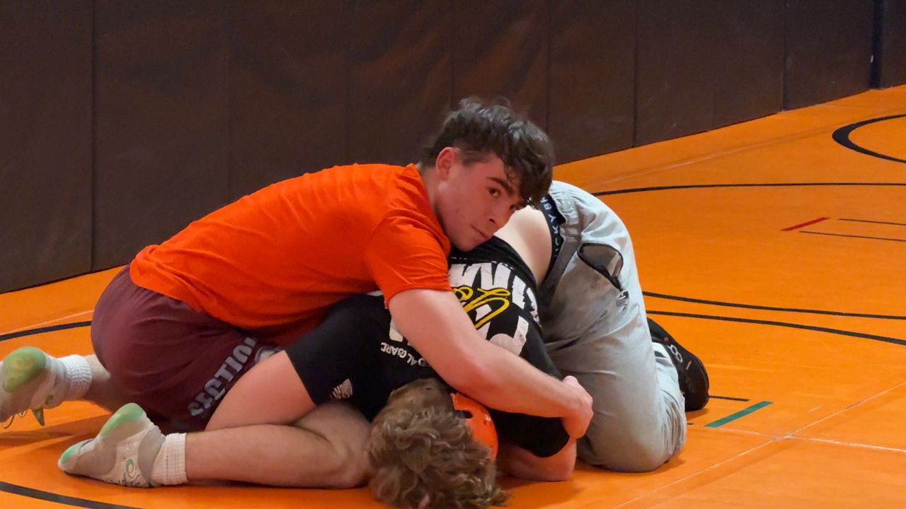 Bethlehem High School senior James Nalbone practices wrestling from the top position