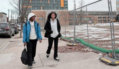 Ninth graders Gabriel Dinkins (left) and Briah Boyd walk home from Paul Robeson High School for Human Services in West Philadelphia.
