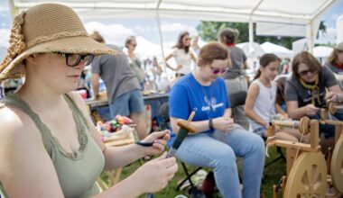 Hannah Black uses a drop spindle to spin yarn along side the Centre Spinners at the People’s Choice Festival of Pennsylvania Arts & Crafts at the Pennsylvania Military Museum in Boalsburg on Friday, July 12, 2019.