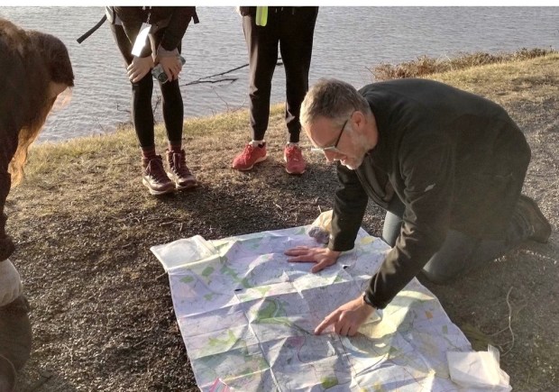 Founder of the Walk Around Philly, JJ Tiziou, plots the group's path along the Delaware. (Photo by JJ Tiziou)